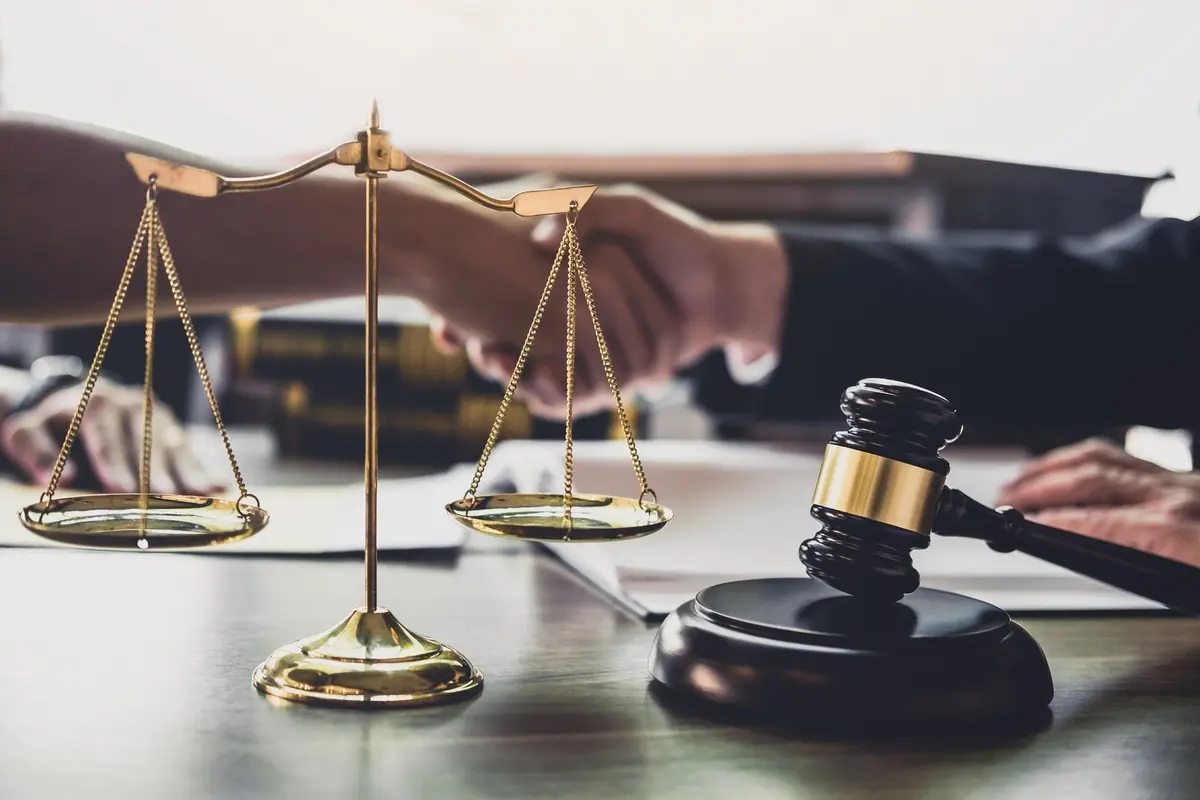 Attorney shaking hands with a client