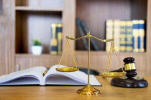Scales of justice and gavel on a wooden desk, symbolizing legal representation and family law services related to asset valuation in divorce proceedings.
