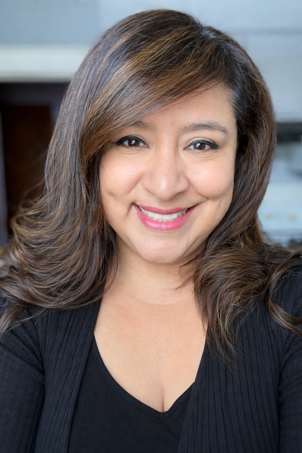 Sonia Gomez, Firm Administrator at First Response Legal, smiling and showcasing professionalism in a close-up portrait.
